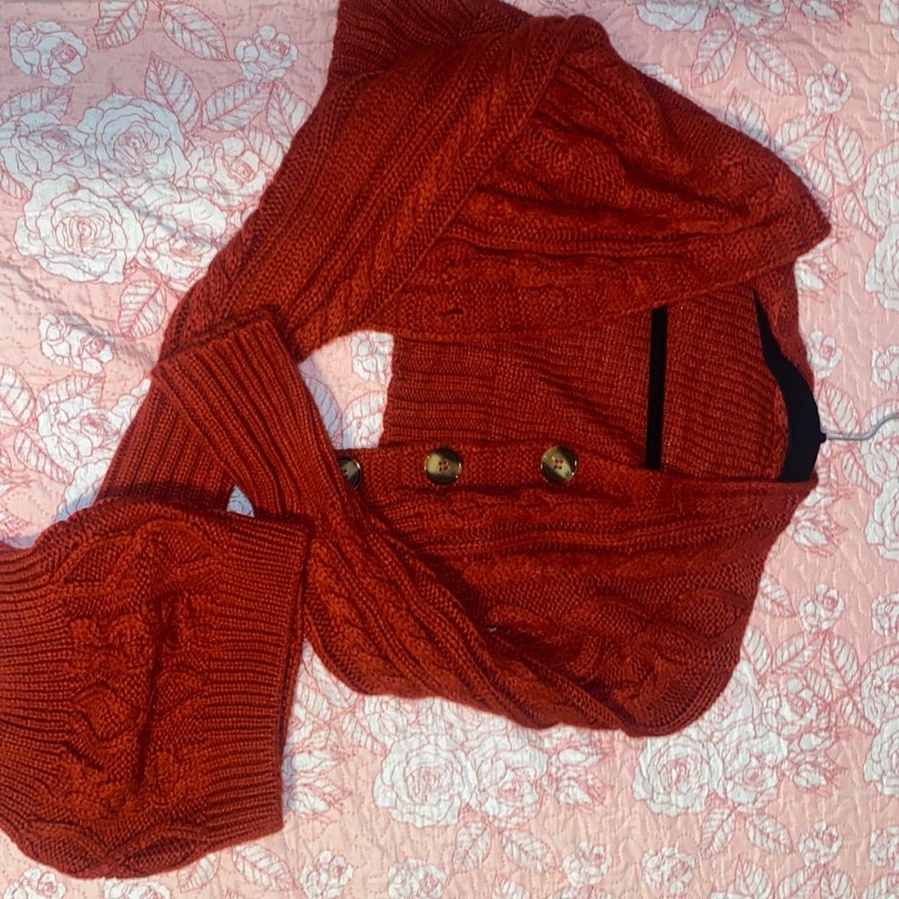 Kit sweater cardigan with tube top piece.